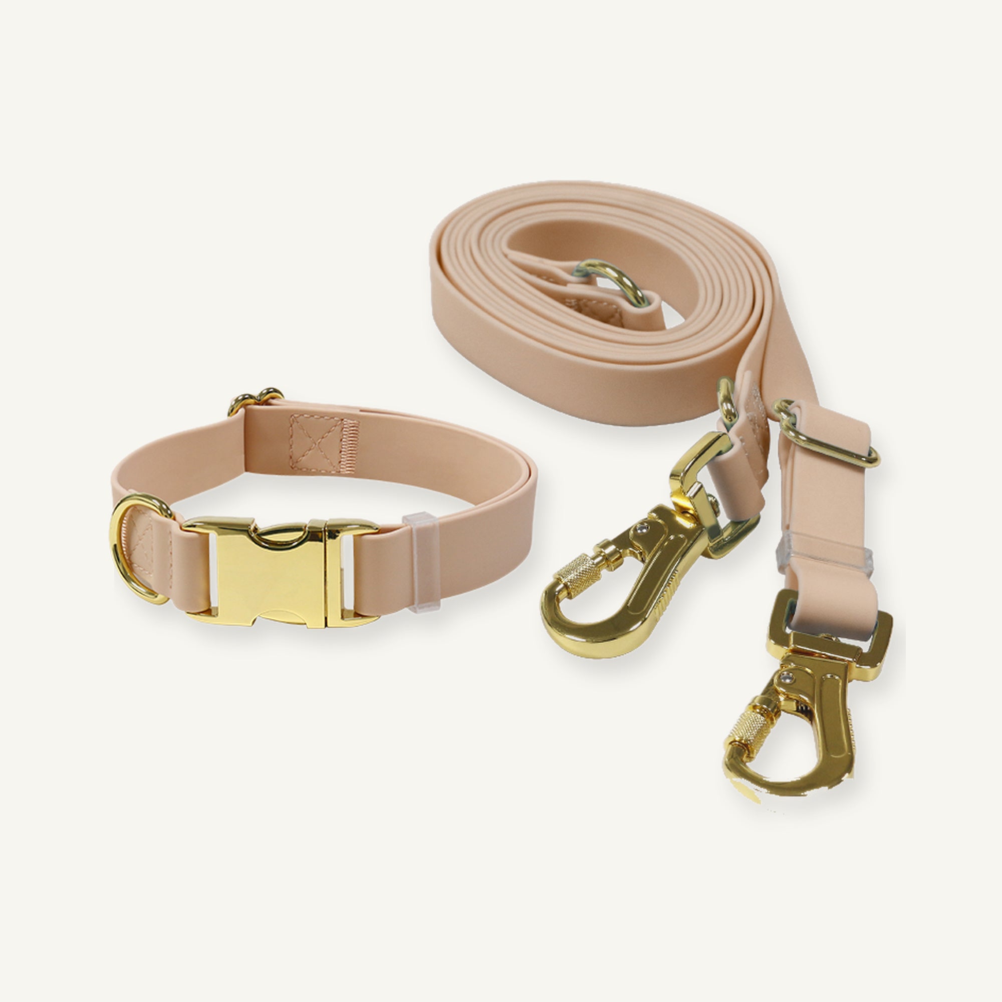 Beige PVC dog collar and leash set displaying matching gold tone hardware