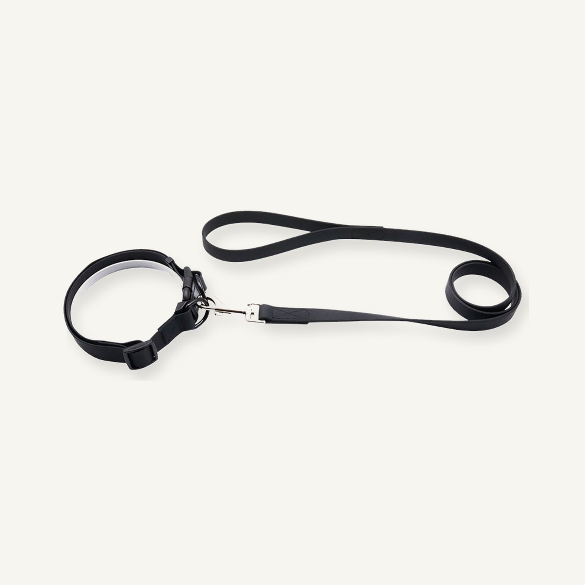 Black padded PVC dog collar leash set displayed with quick release collar