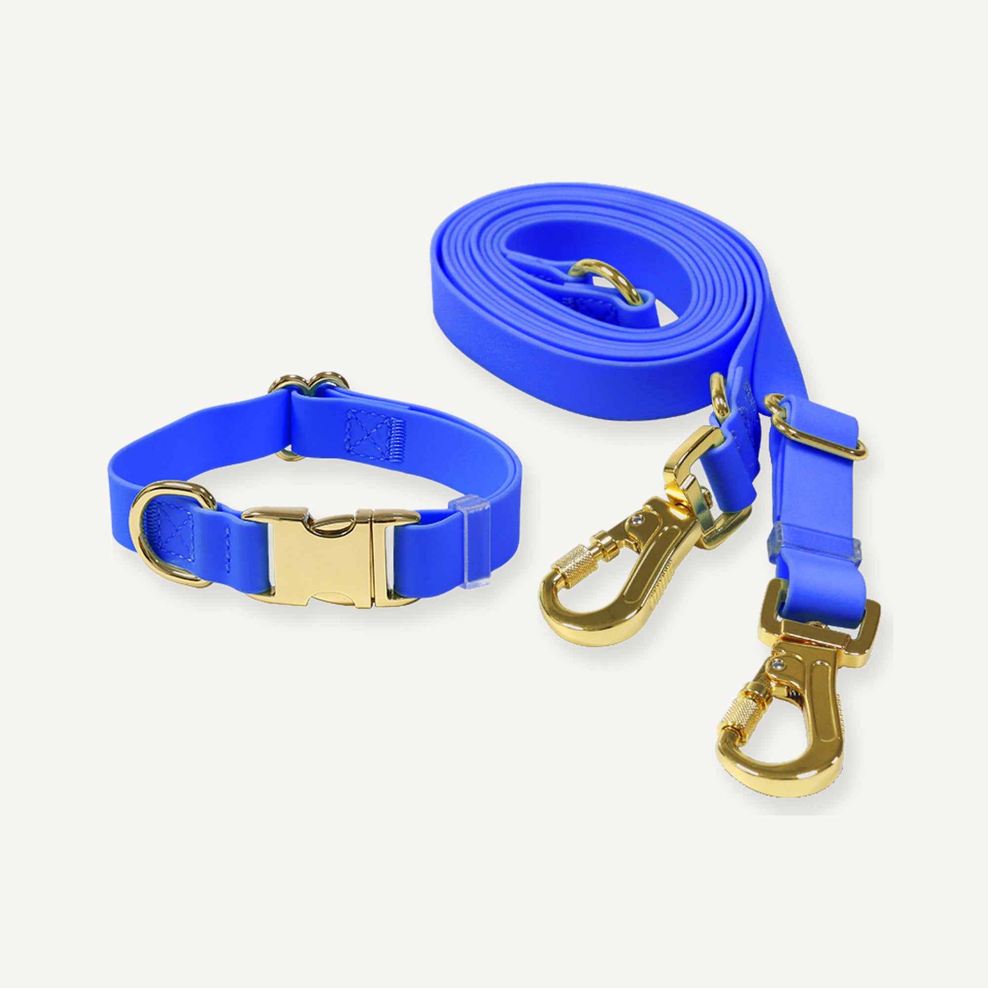 Blue PVC dog collar leash set displaying coordinated straps and gold tone fittings