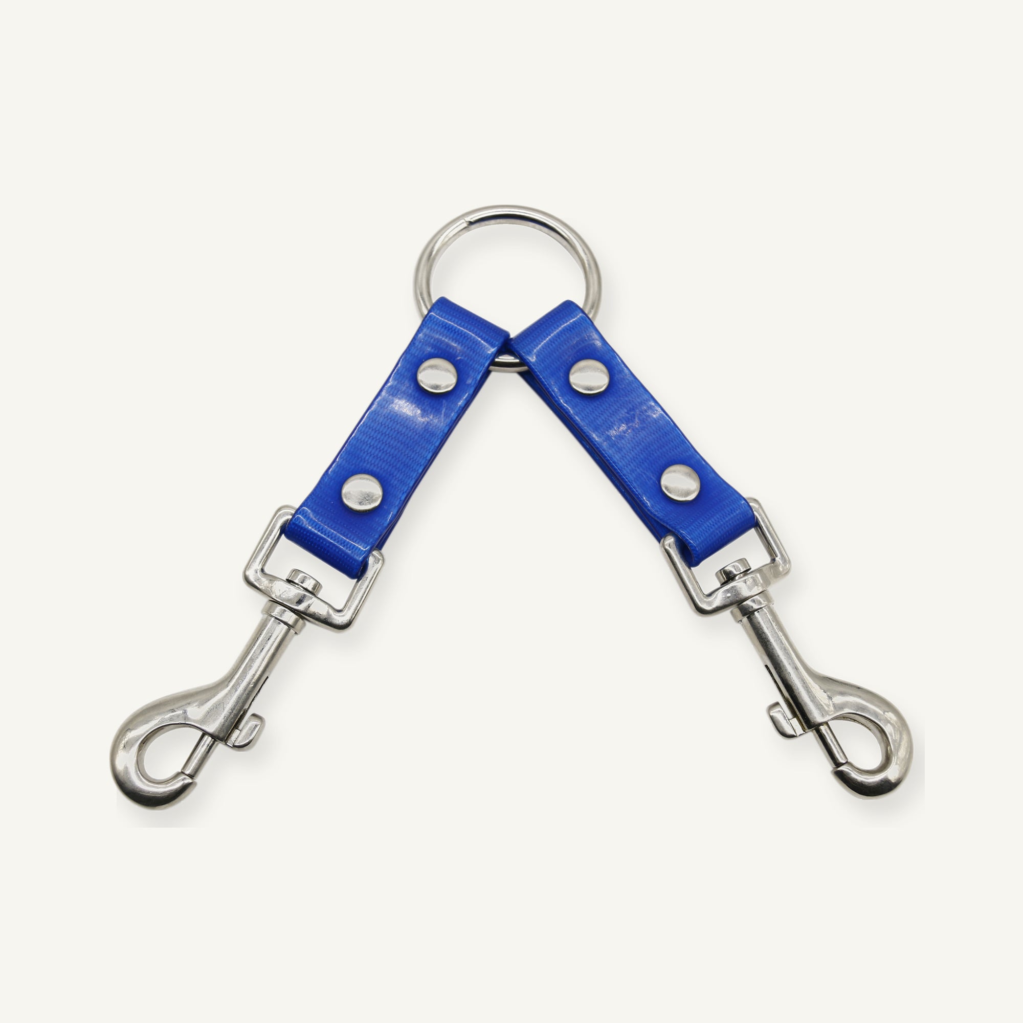 Blue TPU double dog leash coupler close view of the riveted branch junction