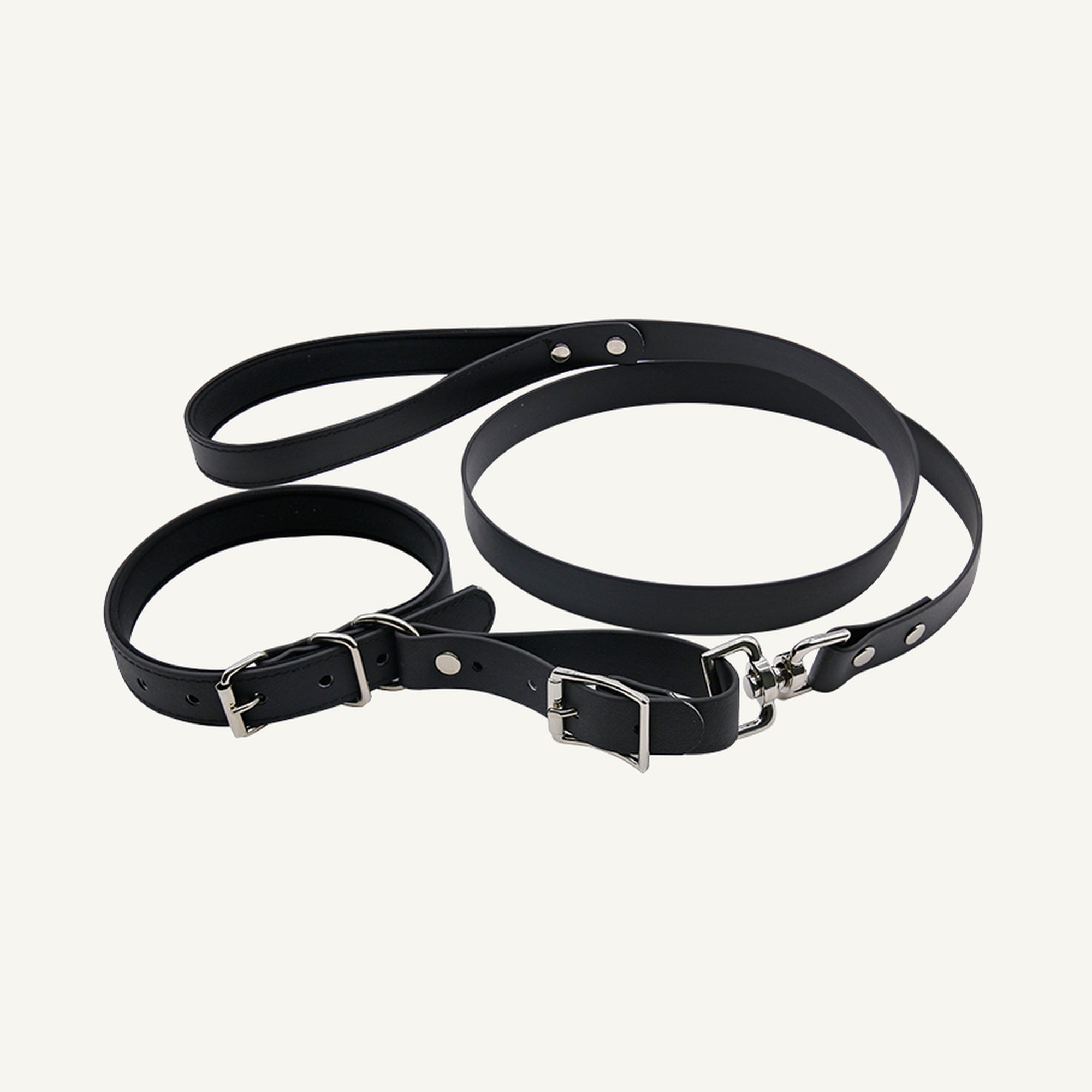 Custom padded PVC integrated dog collar leash set shown in black with connected collar and lead