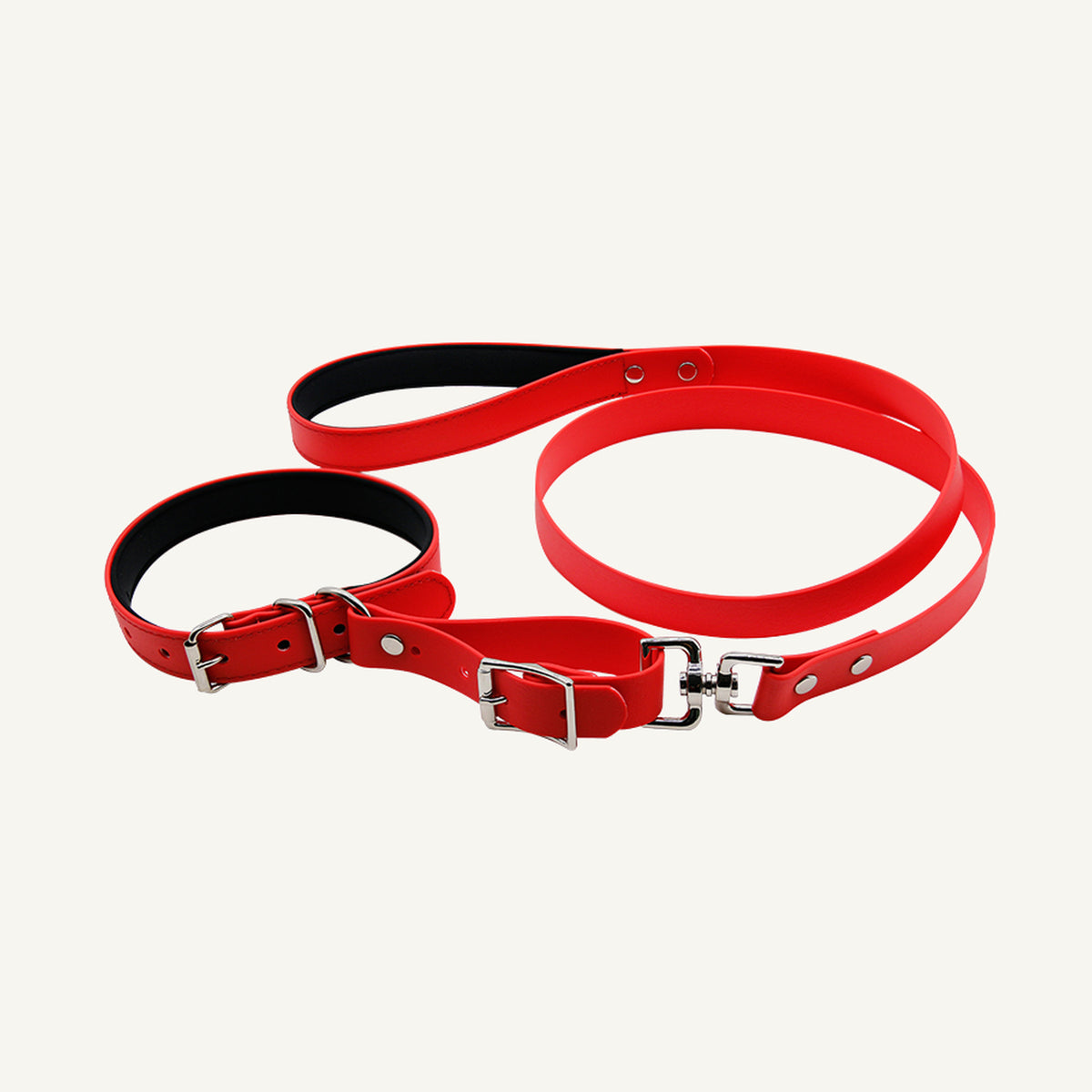 Custom padded PVC integrated dog collar leash set shown in red with connected collar and lead