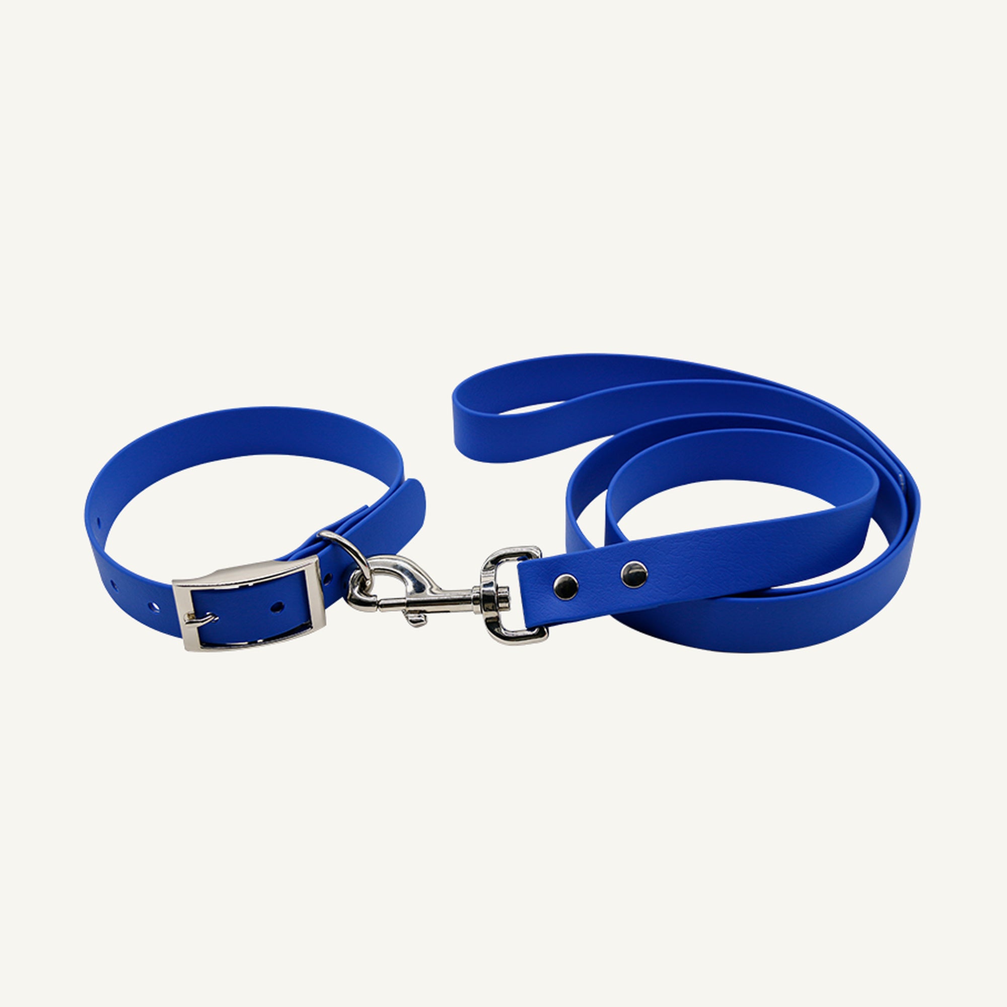 Custom solid PVC integrated dog collar leash set shown in blue with silver tone metal hardware