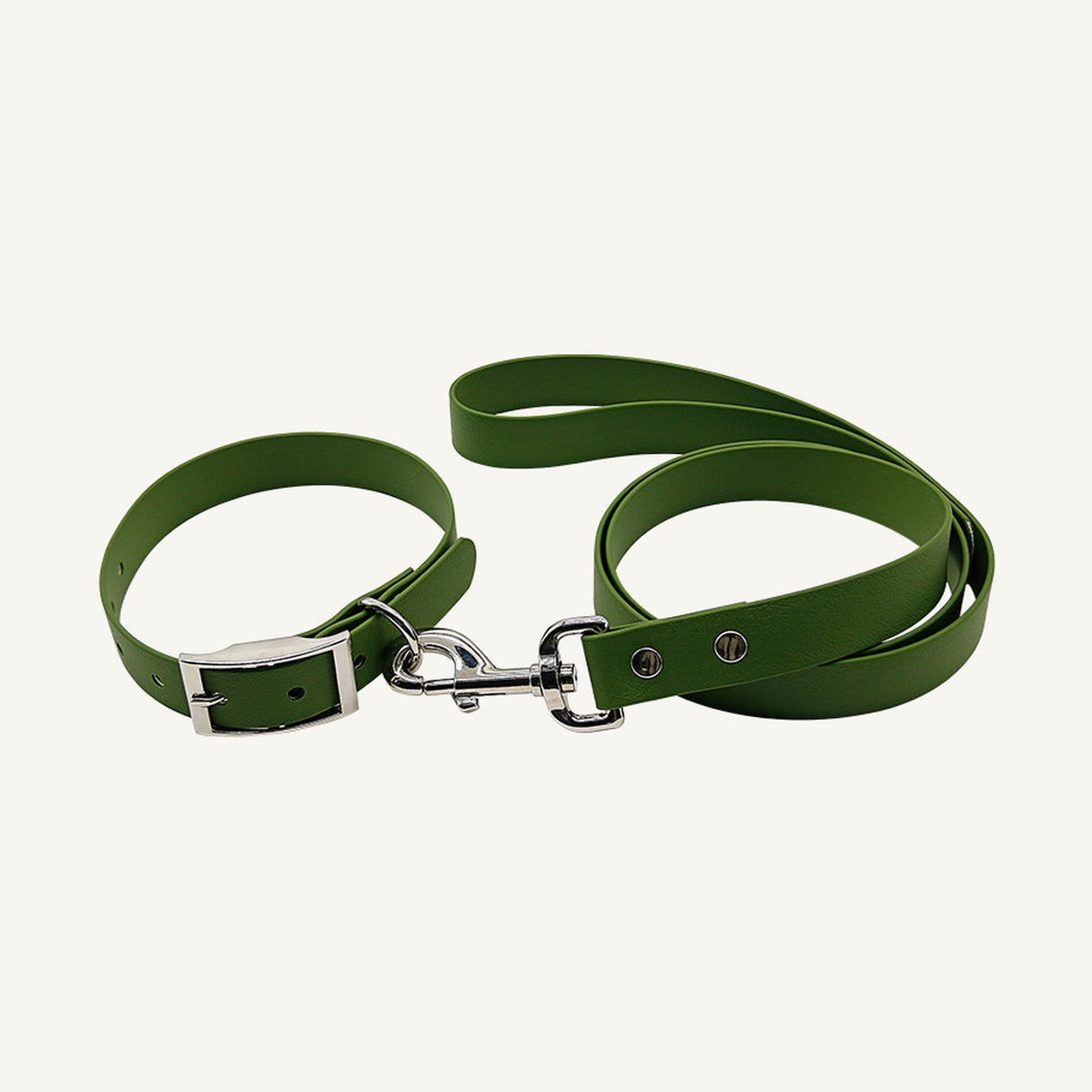 Custom solid PVC integrated dog collar leash set shown in green with silver tone metal hardware