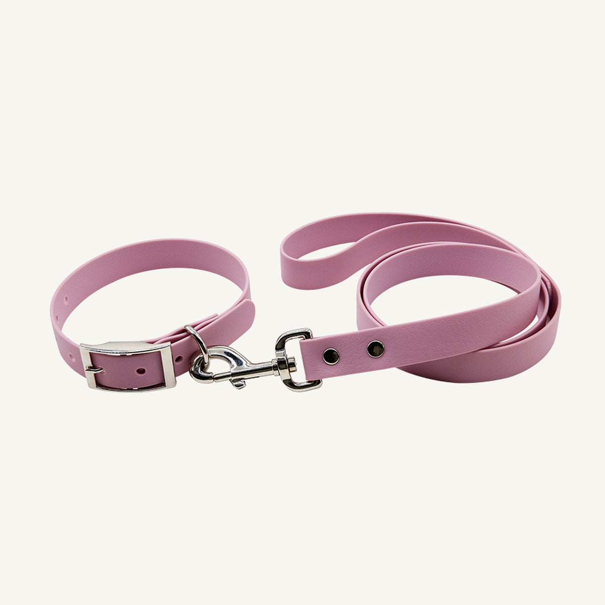 Custom solid PVC integrated dog collar leash set shown in pink with silver tone metal hardware