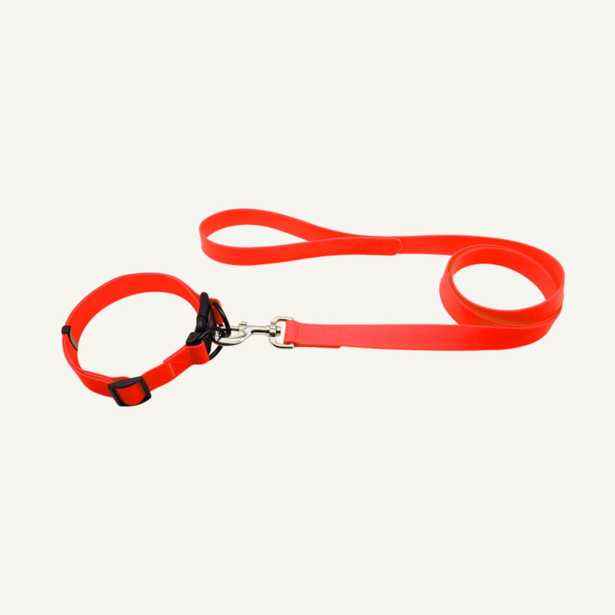 Custom solid PVC quick release dog collar leash set shown in red with adjustable buckle collar and lead