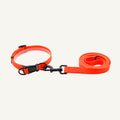 Custom waterproof PVC dog collar and two meter leash set shown in orange with collar and lead