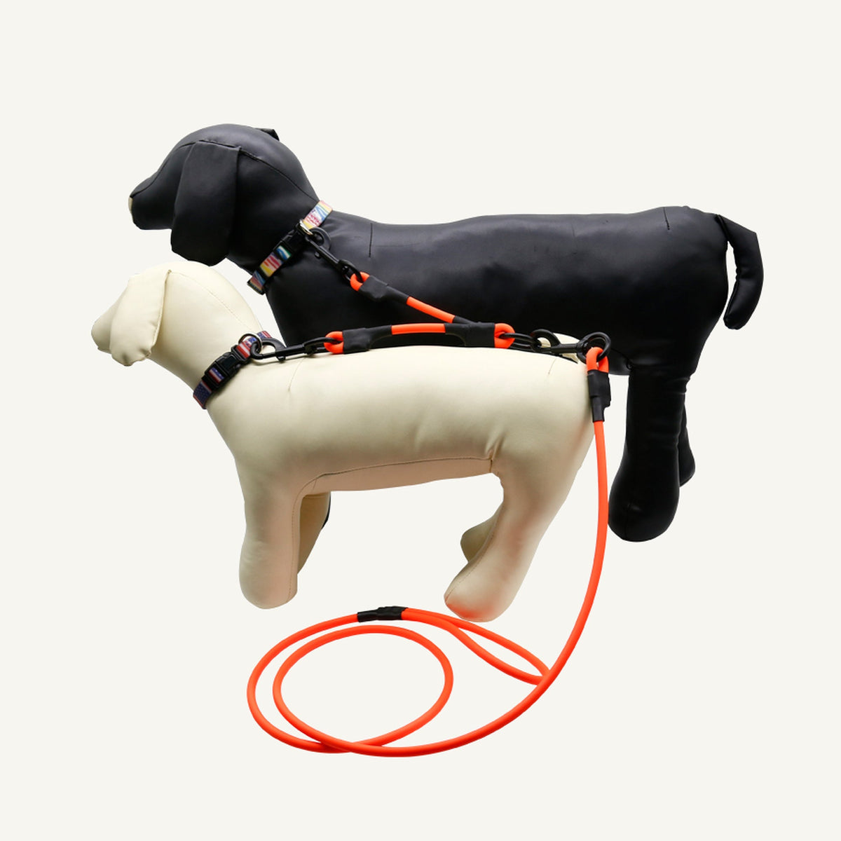 Custom waterproof PVC double dog leash splitter used with two dogs in a coordinated walking setup