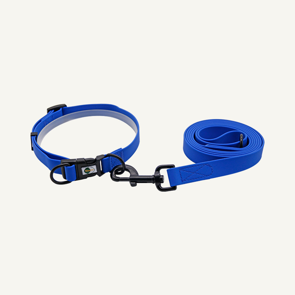 Custom waterproof PVC quick release dog collar leash set shown in dark blue with black hardware and lead