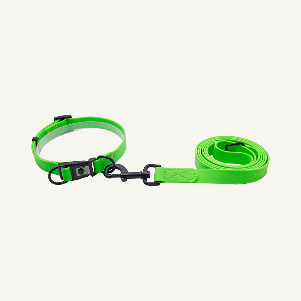 Custom waterproof PVC quick release dog collar leash set shown in green with black hardware and lead