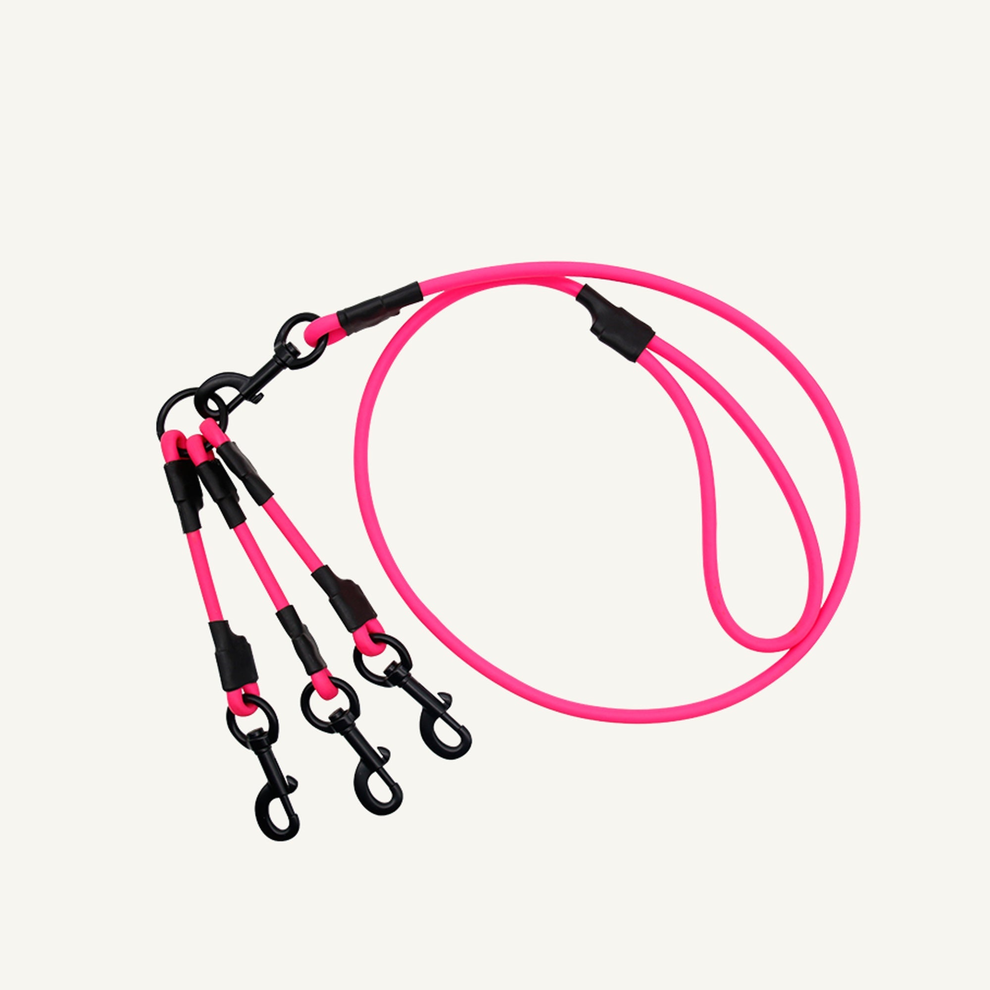 Custom waterproof PVC triple dog leash splitter shown in pink with matching lead and three branches