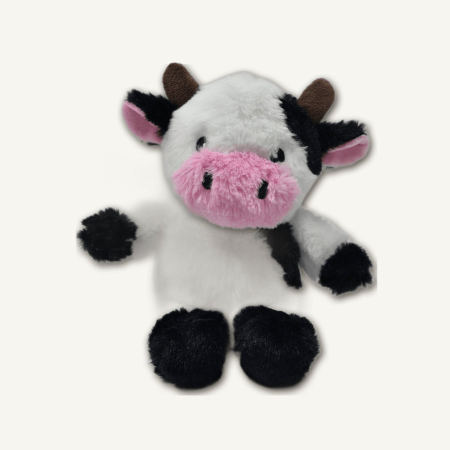 Seated Cow Plush Toy – GMR464 hero product view on warm neutral background for wholesale pet brands