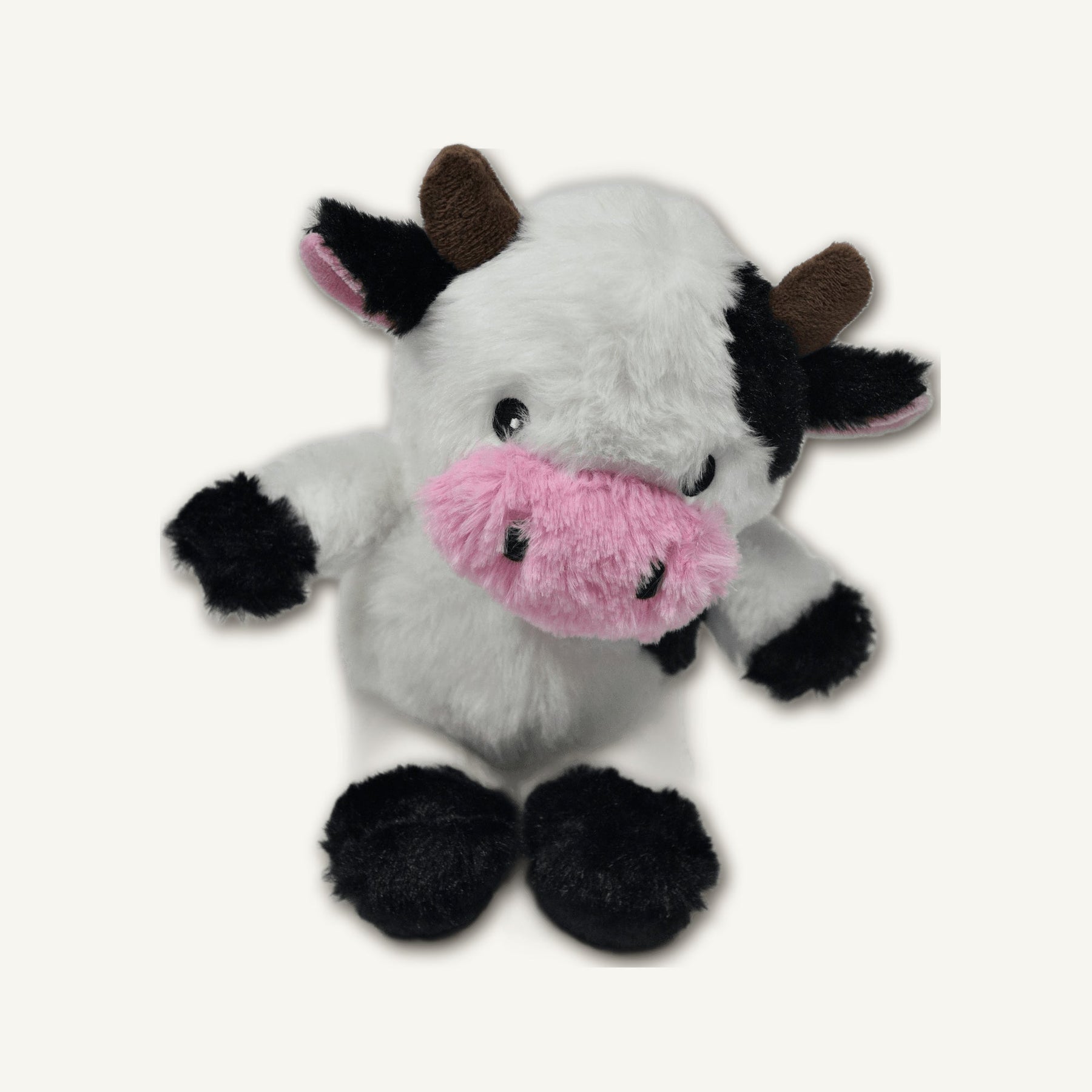 Seated Cow Plush Toy – GMR464 top perspective view on warm neutral background for wholesale pet brands