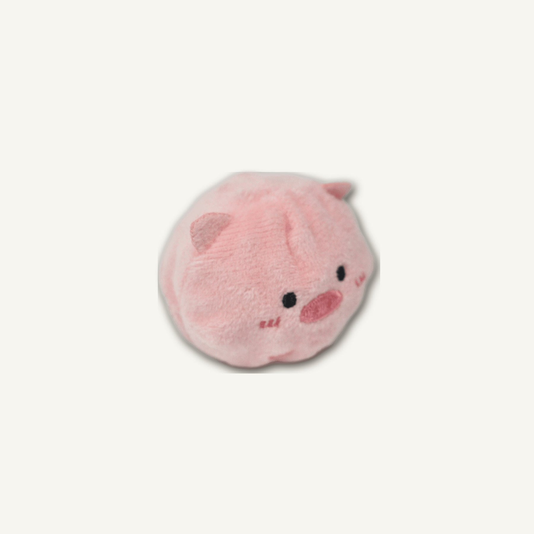 Cute Pig Spiky Ball – GMR520 rear perspective view on warm neutral background for wholesale pet brands