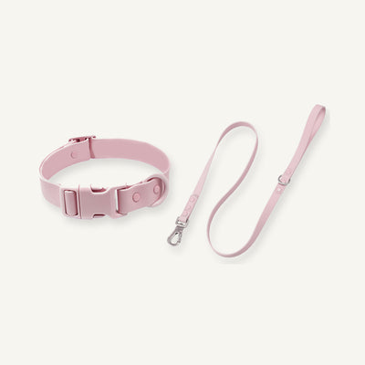 Pink PVC quick release dog collar leash set displayed with coordinated coated straps
