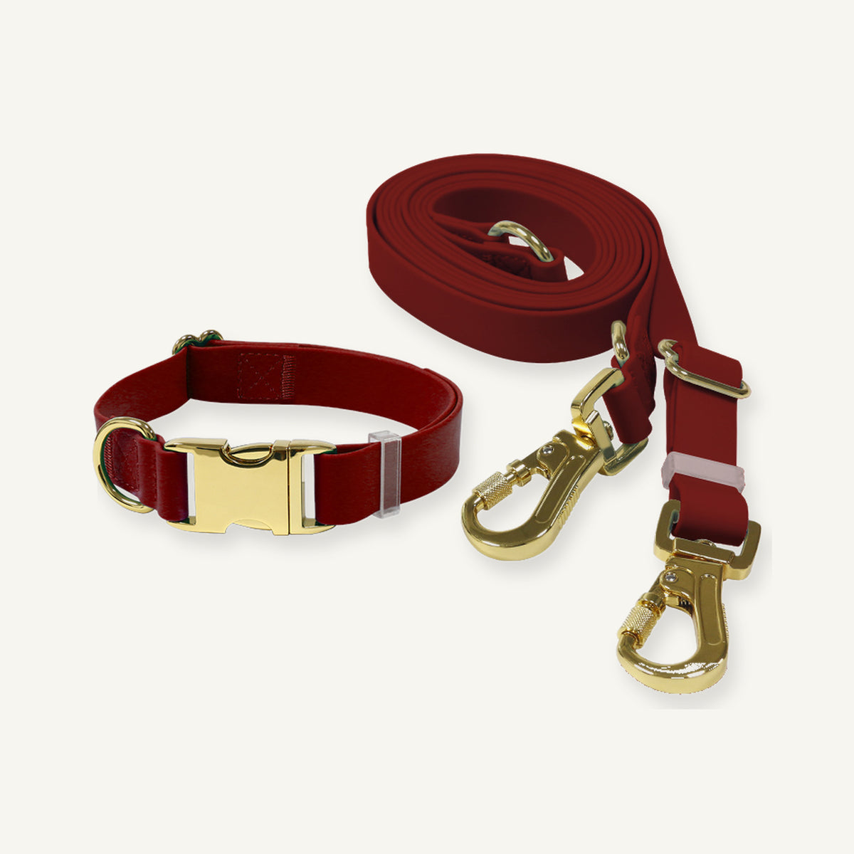 Red PVC collar leash set shown with gold tone buckle clips and rings
