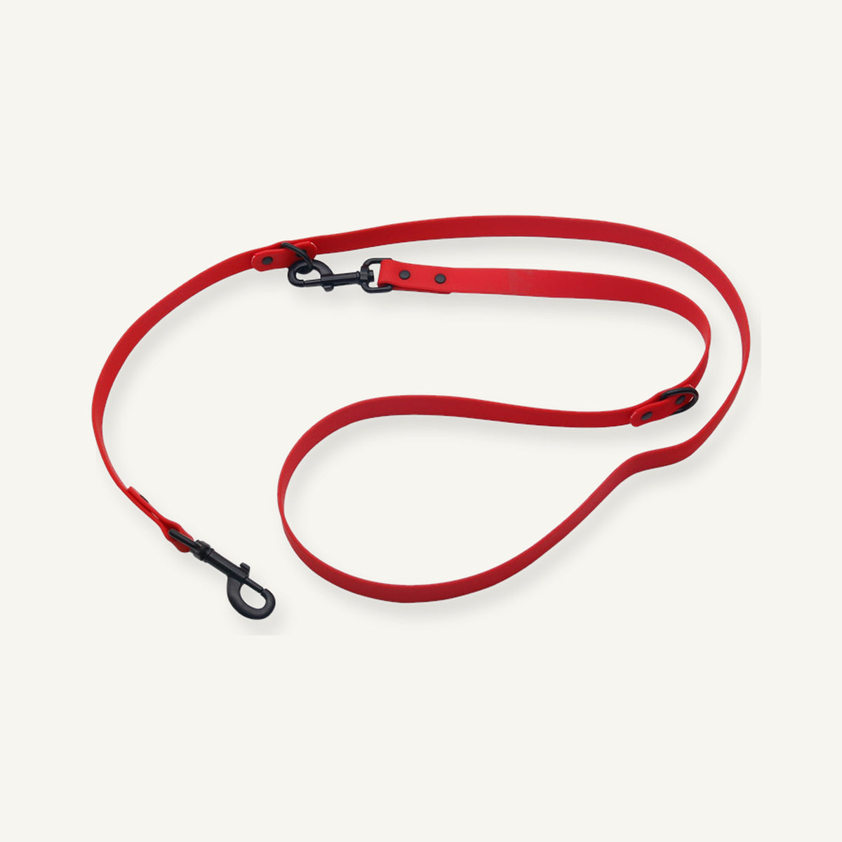 Red embossed PVC multifunction dog leash displayed with black clips and adjustment points